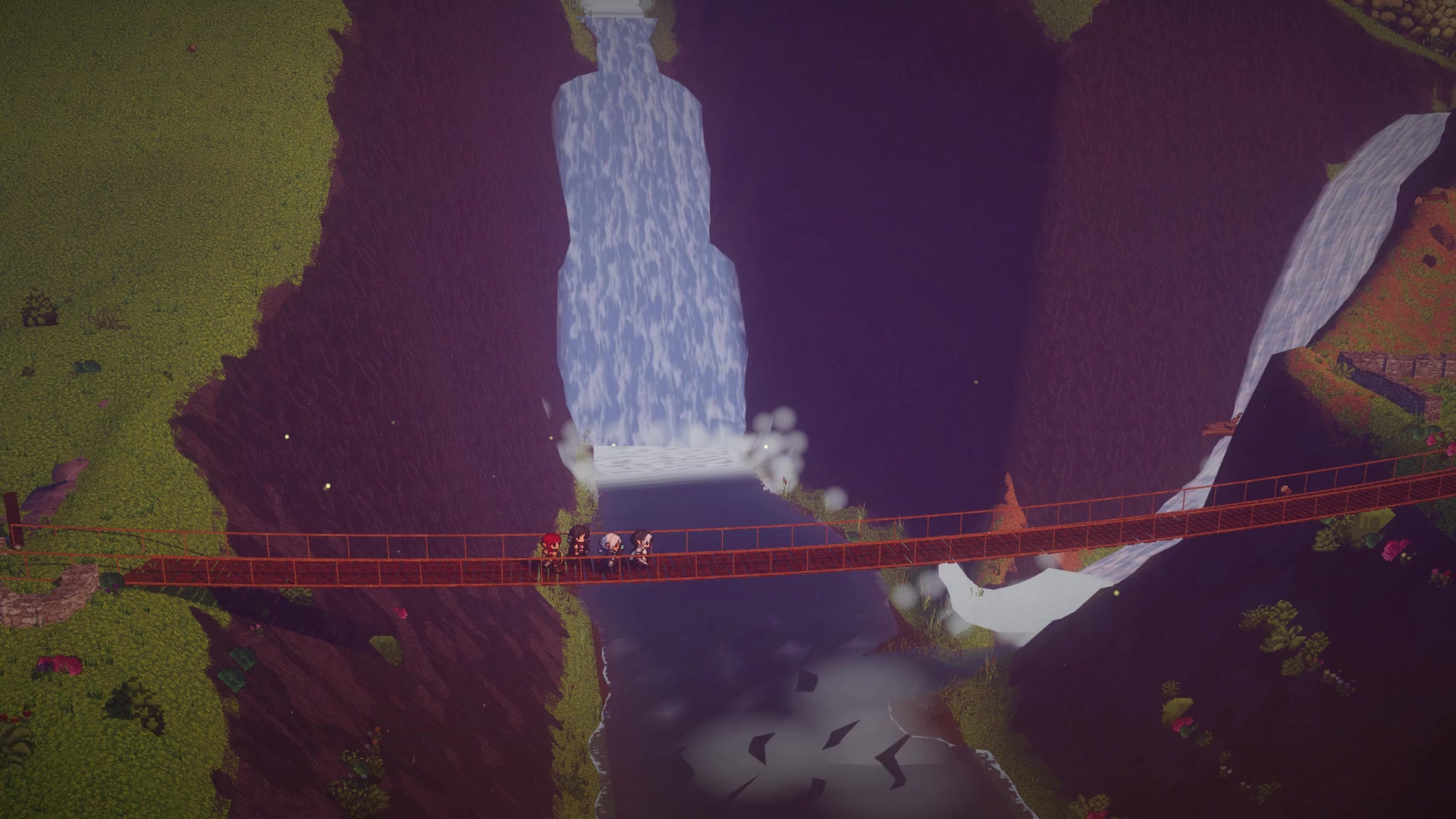 The party crossing a narrow bridge in front of a waterfall.